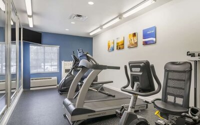 Bright fitness center featuring cardio equipment and exercise machines at Comfort Inn & Suites Port Charlotte-Punta Gorda.