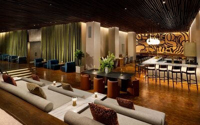 Spacious lobby seating area with upscale lounge furniture and stylish contemporary interiors at Row NYC.