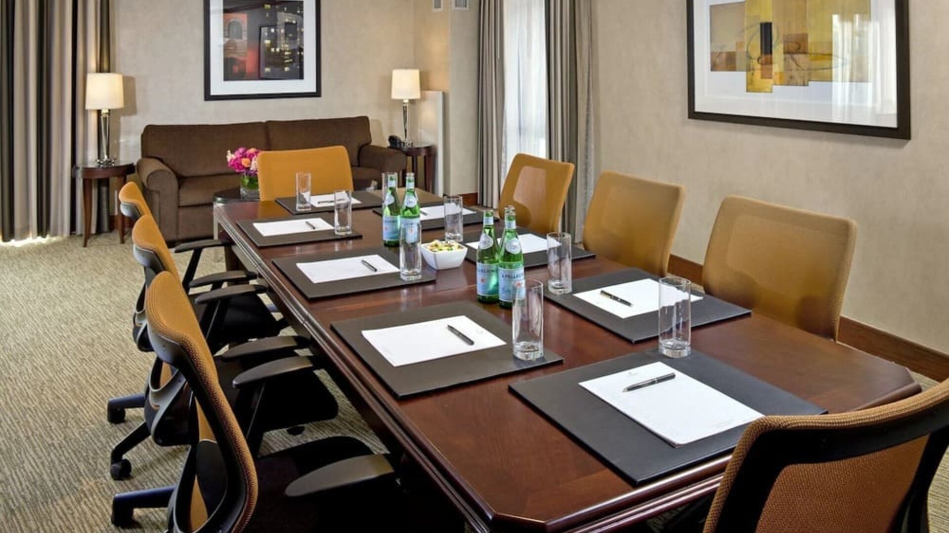 Professional meeting room with conference table setup, ergonomic seating, and business-friendly amenities at The Bostonian Boston, A Millennium Hotel.